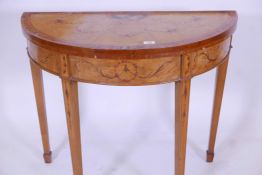 A late C19th/early C20th demi lune satinwood card table, with fold over top, and painted
