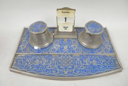 An Eastern blue enamelled metal desk standish with two inkwells and perpetual calendar, 10½" wide