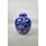 A late C19th/early C20th blue and white porcelain ginger jar and cover with prunus blossom