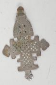 A bronze age pendant cross with ornate pierced and engraved decoration, 3" long