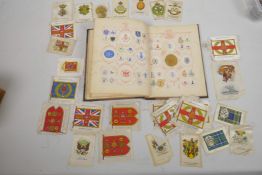 A small album of decorative embossed letterheads, many military and a collection of silk cigarette