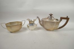 An Art Deco silver three piece tea set, hallmarked Brimingham 1932, 1060g
