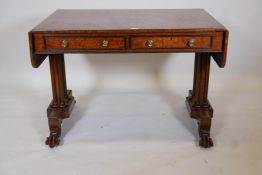 An elm veneered sofa table with ebony inlaid top, two true and two false drawers, raised on
