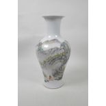 A Chinese famille verte porcelain vase decorated with a sole figure in a mountain landscape, 6