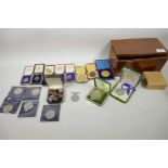 A box of various medals, badges and commemorative coins including 1832 Silver swimming medal, 1939-