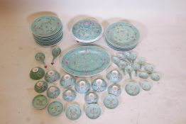 A Chinese famille vert porcelain dinner service including an oval serving plate, soup tureen, 10"