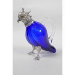 A silver plated and blue glass claret jug in the form of a parrot, 6" high
