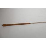 A carriage whip by the Wonder Whip Company Canada with bound leather handle, 66" long