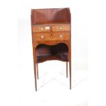 A Georgian inlaid mahogany washstand, with three quarter gallery top over three drawers and an