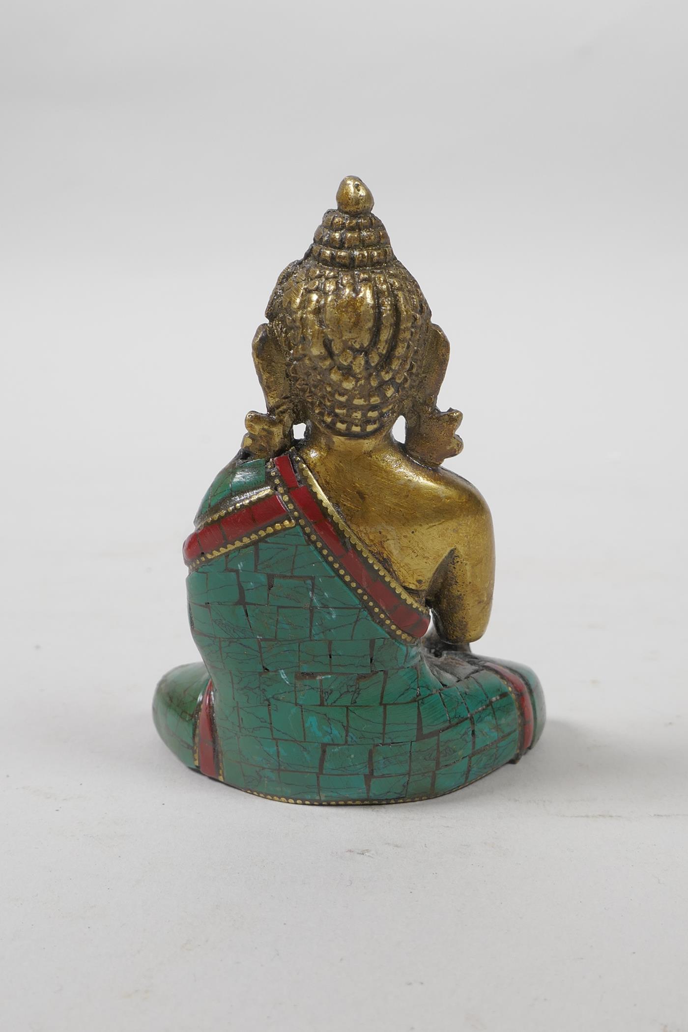 A Tibetan brass Buddha with a stone inset robe, 3" high - Image 2 of 3