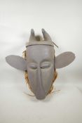 An African painted wood horned mask with large ears, 21½" high