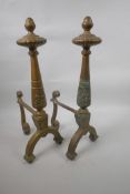A pair of classical style brass fire dogs with engraved decoration, 18" high x 8½" deep