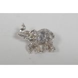 A sterling silver brooch in the form of an elephant, 1" wide