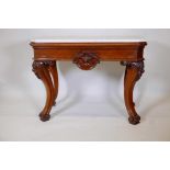 A C19th French walnut console table with Carrara marble top and carved corners, shaped frieze with