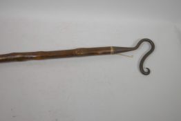 A vintage shepherd's crook with blacksmith wrought iron crook, 63" long