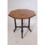 A C19th burr walnut octagonal topped occasional table with five band string inlay on turned and