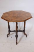 A C19th burr walnut octagonal topped occasional table with five band string inlay on turned and
