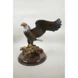 A carved and painted wood eagle, 13" high