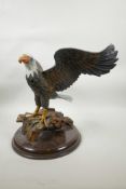 A carved and painted wood eagle, 13" high