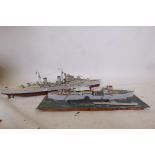 A scratch built motorised card and wood model of a British Naval battleship, 42" long, and a diorama