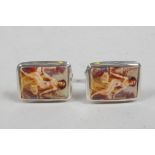 A pair of silver and cold enamel set cufflinks decorated with an odalisque