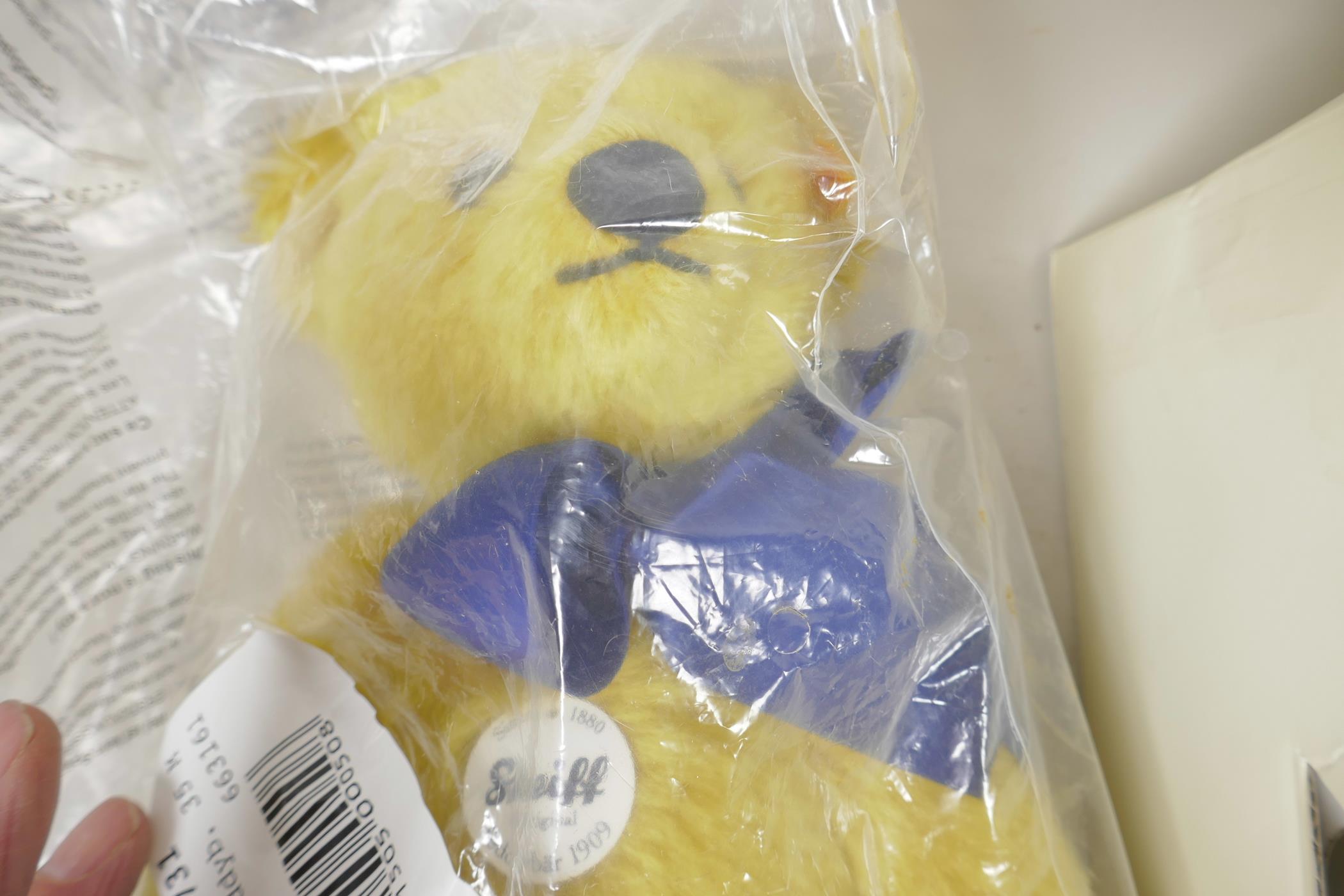 A Steiff 1909 replica teddy bear with growler and blue bow, 13" tall, in original box and packaging - Image 2 of 3