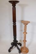 A C19th mahogany torchere with spiral carved and reeded column on four carved legs, 57" high,