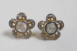 A pair of silver gilt flower shaped earrings set with Indian uncut diamonds