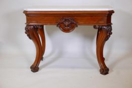 A C19th French walnut console table with Carrara marble top and carved corners, shaped frieze with