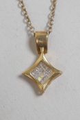 A 14ct yellow gold and diamond pendant on a 925 silver chain