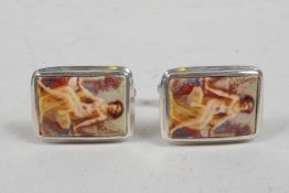 A pair of silver and cold enamel set cufflinks decorated with an odalisque