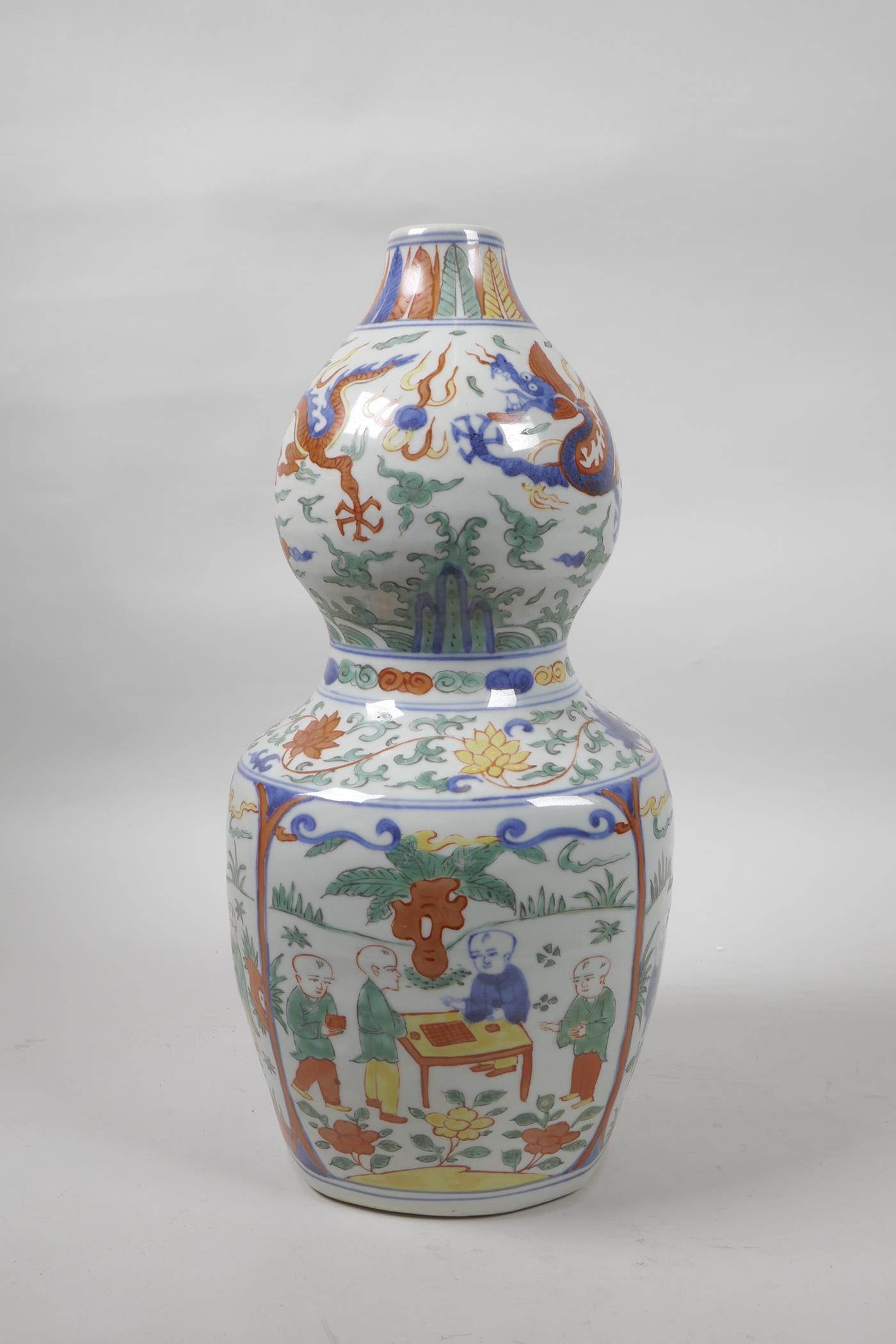 A Chinese wucai porcelain double gourd vase decorated with dragons, lotus flowers and boys at - Image 4 of 5