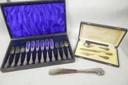 A boxed Christening set of 800 mk fork, spoon and steel bladed knife, together with a boxed set of