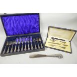 A boxed Christening set of 800 mk fork, spoon and steel bladed knife, together with a boxed set of