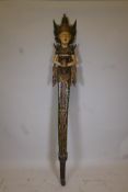 An Indonesian carved and painted wood figural totem, 80" high