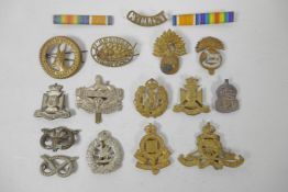 A quantity of assorted British Forces and other service badges