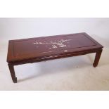 A Chinese hardwood coffee table with inlaid mother of pearl decoration of birds and a prunus tree,