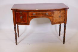 A Georgian inlaid mahogany bowfronted sideboard, with single drawer flanked by a cupboard and deep