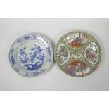 A Chinese polychrome porcelain cabinet plate decorated with figures and flowers, together with a