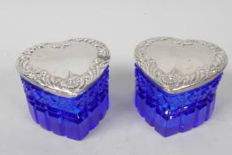 A pair of heart shaped blue glass dressing pots with sterling silver lids, 2" high, 2½" wide