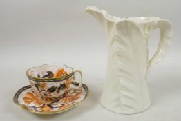 An Art Deco Royal Worcester old white porcelain 'Fern Leaf' pitcher, stamped to base, 7" high;