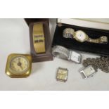 Five various wristwatches and a small brass cased mantel clock (6)