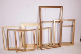 A collection of ten gilt picture frames and slips, largest 40" x 20"