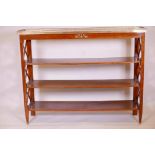 A French style mahogany etagere, with marble top and pierced brass gallery over three shelves, 56" x