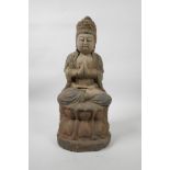 A Chinese painted and distressed carved wood Buddha seated on a lotus throne, 14½" high