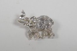 A sterling silver brooch in the form of an elephant, 1" wide