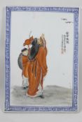 A Chinese polychrome porcelain panel decorated with Lohan in red robes, 10" x 14½"