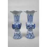 A pair of Chinese blue and white porcelain Gu shaped vases with frilled rims, decorated with birds
