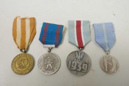 Four Eastern European medals from the mid C20th and Second World War, to include: The Polish Victory