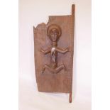 An African carved hardwood door decorated with a female nude figure, 66" high x 26" wide